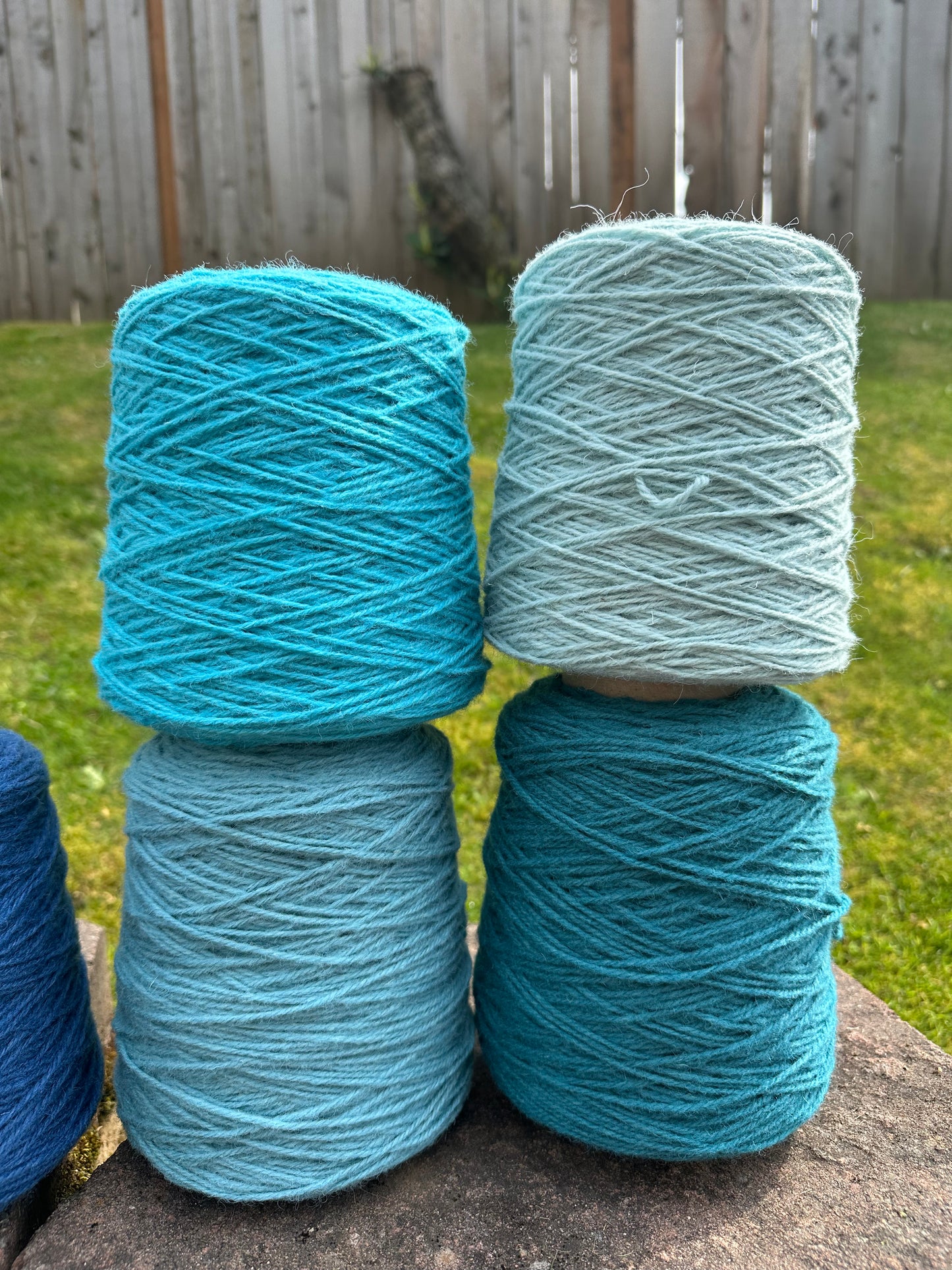 Bright blue 100% rug wool on cone for tufting
