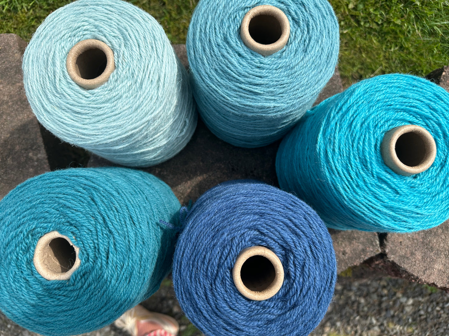 Bright blue 100% rug wool on cone for tufting